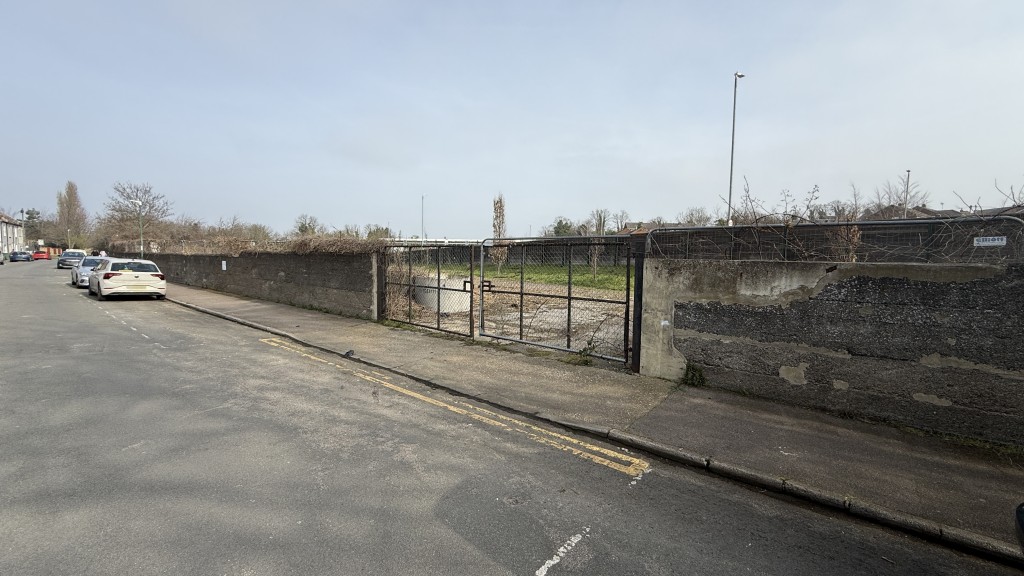Lot: 24 - OPEN YARD AND LAND OFF KING EDWARD ROAD WITH POTENTIAL - External image of access gate onto site